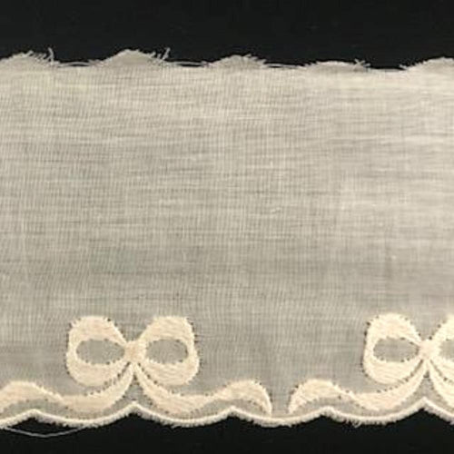 E-94 Ecru - 60mm Embroidered Edging with Bows.