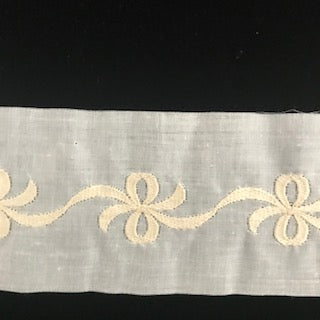 E-93 Ivory, Ecru and Ecru on White - 60mm Embroidered Insertion with Bows.